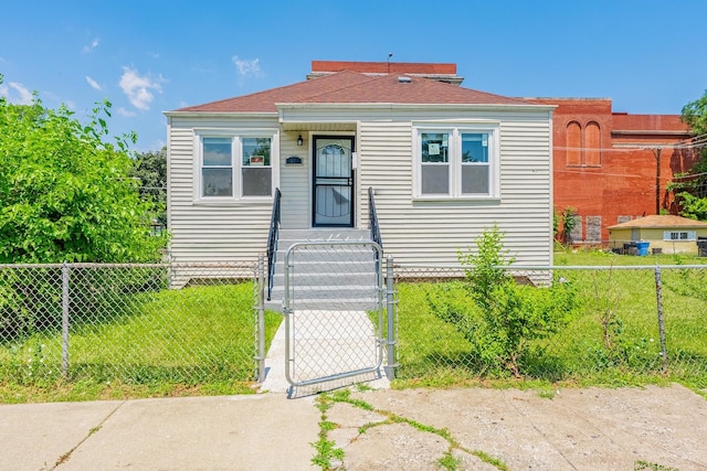 58 W 118th St, Chicago, IL 60628 - view of front of home with a gate and a fenced front yard