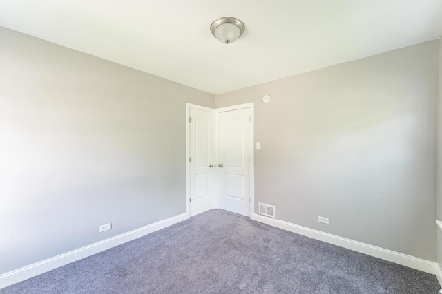 58 W 118th St, Chicago, IL 60628 - spare room featuring baseboards and carpet