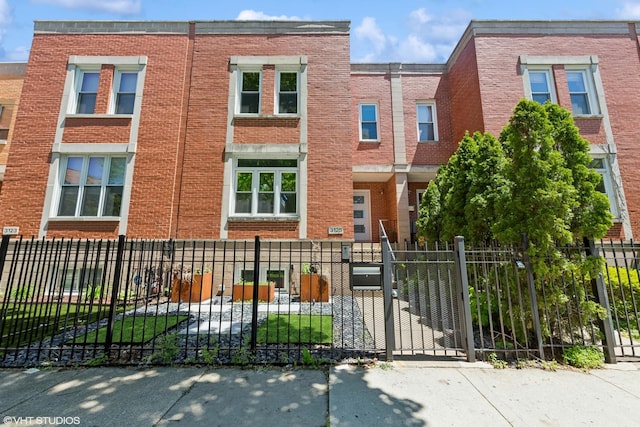3125 S Giles Ave, Chicago, IL 60616 - multi unit property with brick siding and a fenced front yard