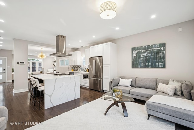 3125 S Giles Ave, Chicago, IL 60616 - kitchen with stainless steel appliances, island range hood, open floor plan, and recessed lighting
