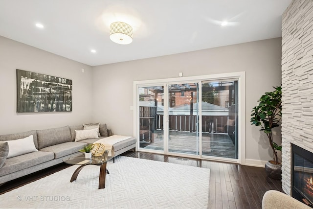 3125 S Giles Ave, Chicago, IL 60616 - living room featuring dark wood-style flooring, a fireplace, and recessed lighting