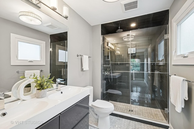 3125 S Giles Ave, Chicago, IL 60616 - bathroom featuring a stall shower, double vanity, healthy amount of natural light, and tile patterned flooring