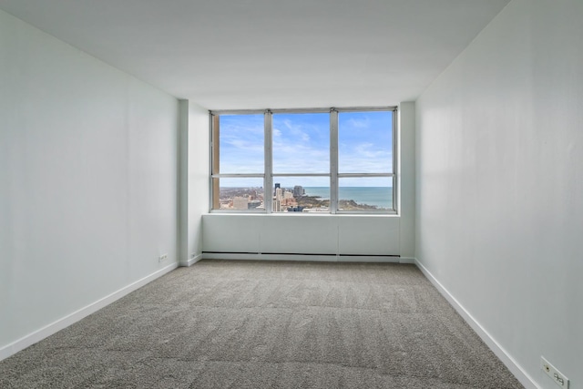 655 W Irving Park Rd Unit 4808, Chicago, IL 60613 - carpeted empty room with baseboards and a baseboard heating unit