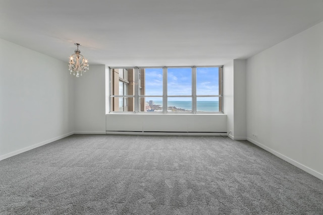 655 W Irving Park Rd Unit 4808, Chicago, IL 60613 - empty room with a chandelier, carpet floors, and a baseboard radiator