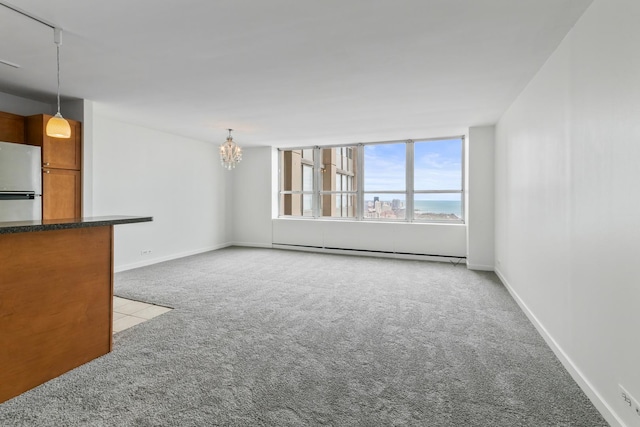 655 W Irving Park Rd Unit 4808, Chicago, IL 60613 - unfurnished living room with carpet, a baseboard radiator, and a chandelier