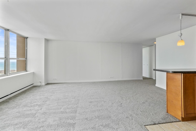 655 W Irving Park Rd Unit 4808, Chicago, IL 60613 - unfurnished living room featuring light carpet and baseboards