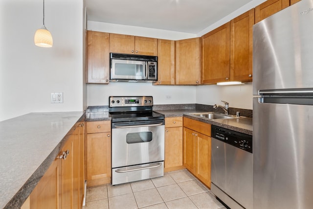 655 W Irving Park Rd Unit 4808, Chicago, IL 60613 - kitchen featuring stainless steel appliances, light tile patterned floors, dark countertops, hanging light fixtures, and brown cabinetry
