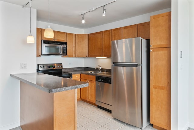 655 W Irving Park Rd Unit 4808, Chicago, IL 60613 - kitchen featuring stainless steel appliances, a peninsula, light tile patterned flooring, hanging light fixtures, and track lighting