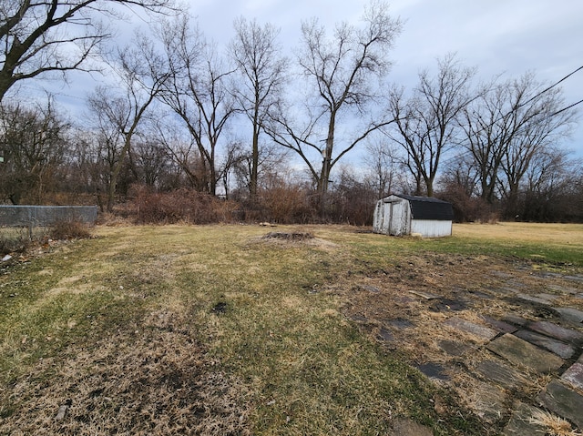 3236 Roesner Dr, Markham, IL 60428 - view of grassy yard featuring a storage shed