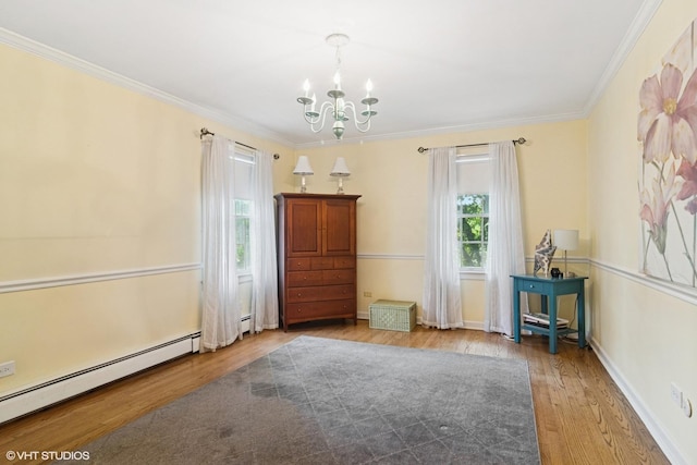 401 S Carlyle Pl, Arlington Heights, IL 60004 - unfurnished room with wood finished floors, a chandelier, baseboard heating, and ornamental molding
