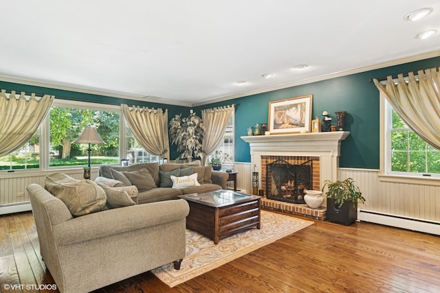 401 S Carlyle Pl, Arlington Heights, IL 60004 - living area featuring wood-type flooring, a wainscoted wall, baseboard heating, a fireplace, and crown molding
