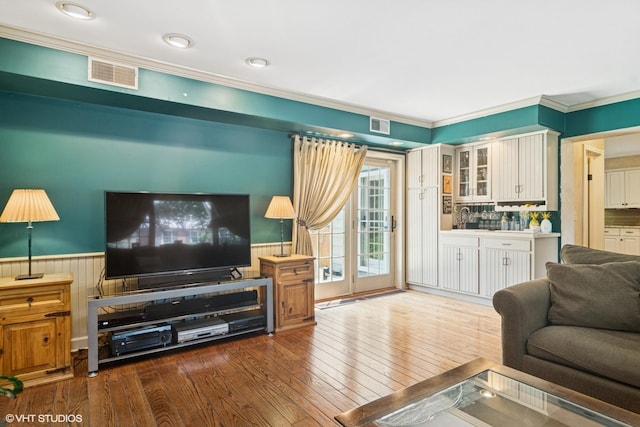 401 S Carlyle Pl, Arlington Heights, IL 60004 - living room featuring hardwood / wood-style flooring, ornamental molding, wainscoting, and wooden walls