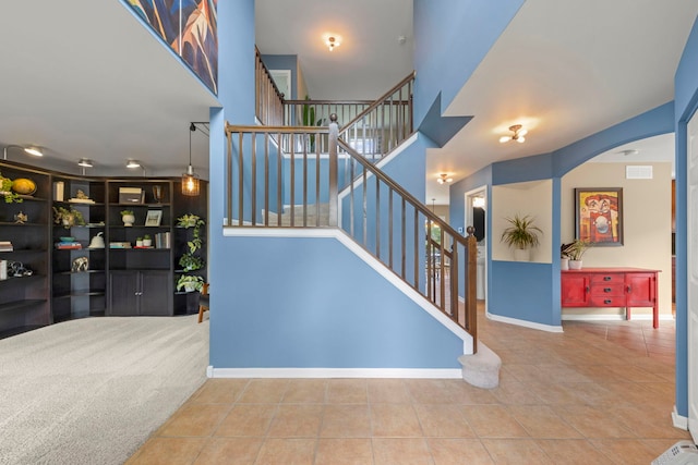 1644 Prairieview Blvd, Bolingbrook, IL 60490 - staircase featuring arched walkways and tile patterned flooring