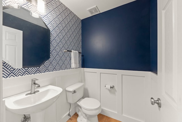 1644 Prairieview Blvd, Bolingbrook, IL 60490 - half bath with a wainscoted wall, wallpapered walls, and a decorative wall