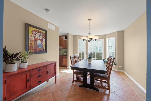 1644 Prairieview Blvd, Bolingbrook, IL 60490 - dining space featuring a chandelier and light tile patterned flooring