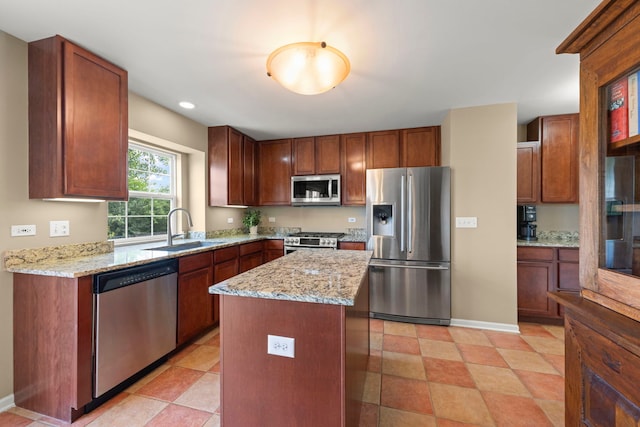 1644 Prairieview Blvd, Bolingbrook, IL 60490 - kitchen with appliances with stainless steel finishes, light stone countertops, a center island, recessed lighting, and brown cabinets