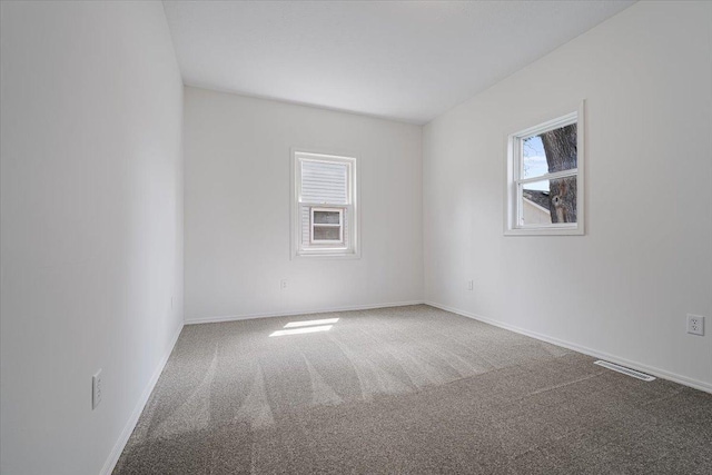710 W Walnut St, Bloomington, IL 61701 - spare room featuring carpet flooring and baseboards