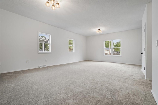 710 W Walnut St, Bloomington, IL 61701 - unfurnished room featuring carpet flooring and baseboards