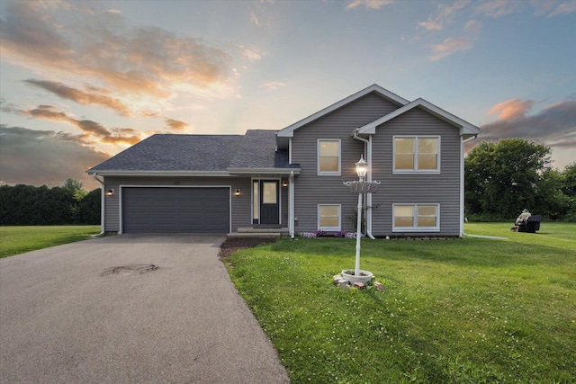 113 New Brunswick Ln, Poplar Grove, IL 61065 - tri-level home featuring driveway, a front lawn, a garage, and roof with shingles