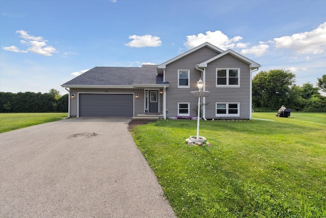 113 New Brunswick Ln, Poplar Grove, IL 61065 - tri-level home with asphalt driveway, a front lawn, and a garage