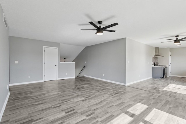 113 New Brunswick Ln, Poplar Grove, IL 61065 - unfurnished living room featuring a ceiling fan and wood finished floors