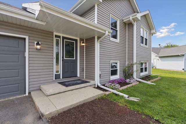 113 New Brunswick Ln, Poplar Grove, IL 61065 - property entrance featuring a lawn and an attached garage