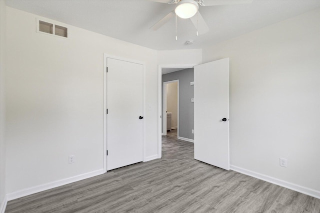 113 New Brunswick Ln, Poplar Grove, IL 61065 - unfurnished bedroom with light wood-style floors and ceiling fan