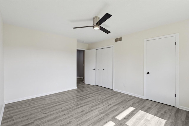 113 New Brunswick Ln, Poplar Grove, IL 61065 - unfurnished bedroom featuring wood finished floors, ceiling fan, and a closet
