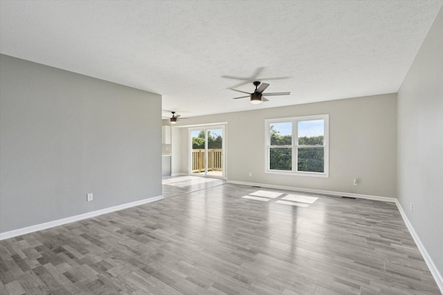 113 New Brunswick Ln, Poplar Grove, IL 61065 - spare room featuring ceiling fan, a textured ceiling, and wood finished floors