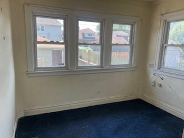 401 23rd Ave, Bellwood, IL 60104 - unfurnished room with dark colored carpet