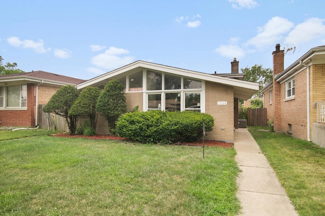 15224 Oak St, Dolton, IL 60419 - mid-century home featuring brick siding and a chimney