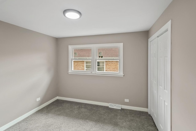 15224 Oak St, Dolton, IL 60419 - unfurnished bedroom featuring dark colored carpet and a closet