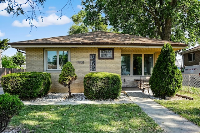 7010 W 72nd St, Chicago, IL 60638 - bungalow-style home featuring brick siding and a shingled roof