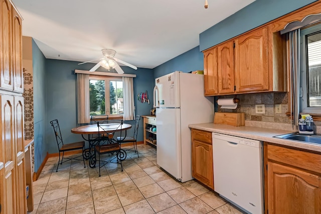 7010 W 72nd St, Chicago, IL 60638 - kitchen featuring white appliances, healthy amount of natural light, a ceiling fan, and light countertops