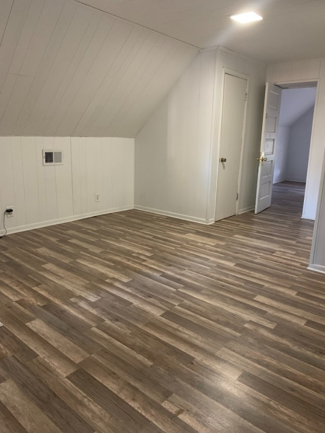 3255 N Kenneth Ave, Chicago, IL 60641 - additional living space with dark wood-style flooring and vaulted ceiling
