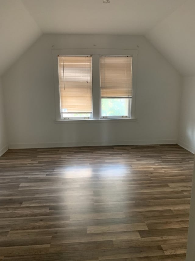 3255 N Kenneth Ave, Chicago, IL 60641 - additional living space featuring vaulted ceiling and dark wood-style floors