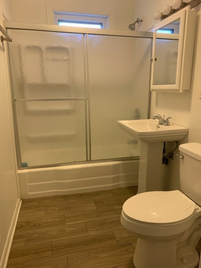 3255 N Kenneth Ave, Chicago, IL 60641 - bathroom featuring combined bath / shower with glass door and wood finished floors