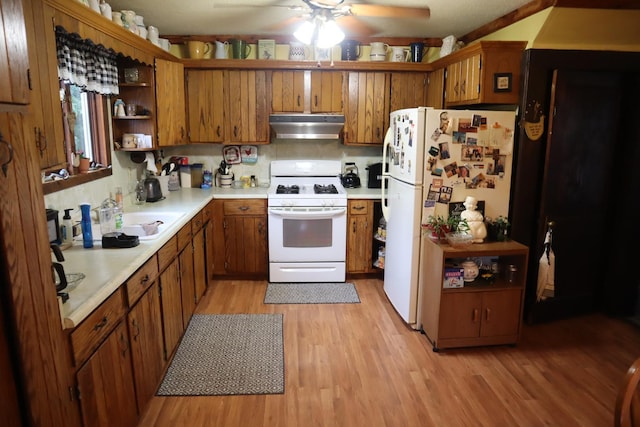 105 Bradley St, New Bedford, IL 61346 - kitchen with white appliances, ventilation hood, open shelves, brown cabinetry, and light wood-style floors