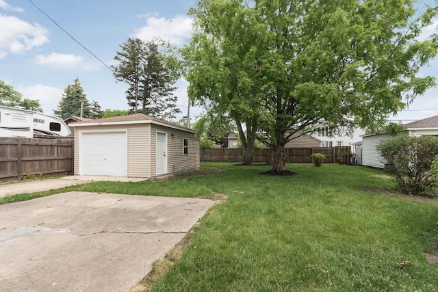 1225 Highridge Pkwy, Westchester, IL 60154 - view of yard with an outbuilding, a garage, and concrete driveway