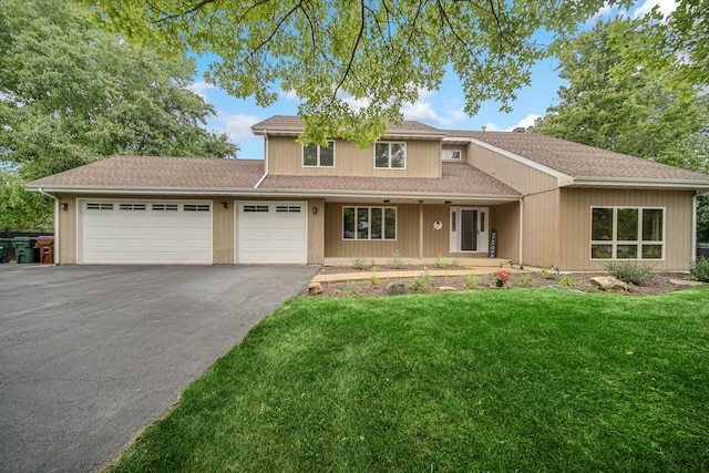 13460 185th St, Mokena, IL 60448 - traditional-style house with a garage, asphalt driveway, a front yard, and covered porch