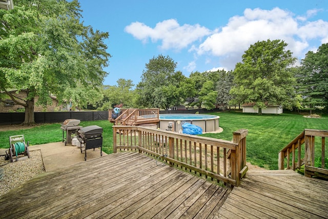 13460 185th St, Mokena, IL 60448 - deck featuring an outdoor pool, grilling area, a fenced backyard, a patio area, and view of wooded area