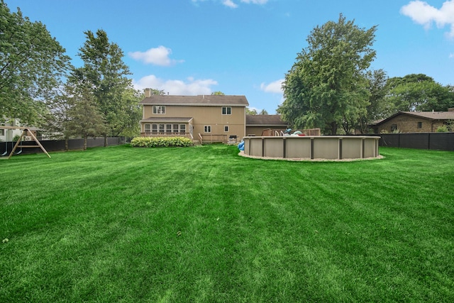 13460 185th St, Mokena, IL 60448 - back of house featuring a fenced backyard and a chimney