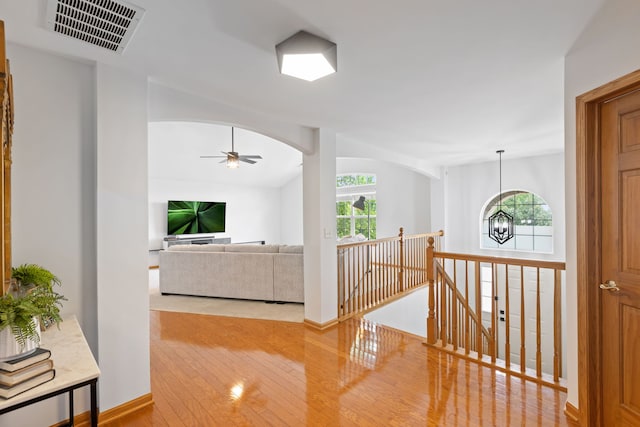 2599 Oak Dr Unit 2599, West Dundee, IL 60118 - hall featuring hardwood / wood-style flooring, an upstairs landing, plenty of natural light, and a chandelier