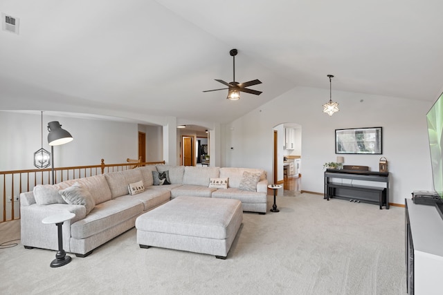 2599 Oak Dr Unit 2599, West Dundee, IL 60118 - living room featuring arched walkways, a ceiling fan, light colored carpet, and vaulted ceiling