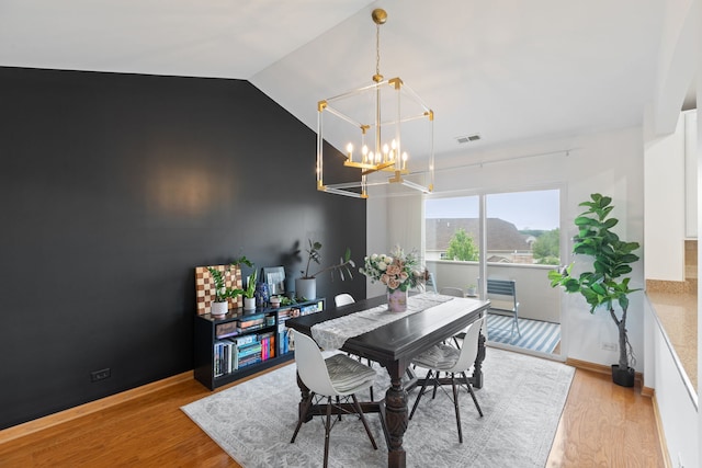 2599 Oak Dr Unit 2599, West Dundee, IL 60118 - dining room with a chandelier, lofted ceiling, and light wood-style floors