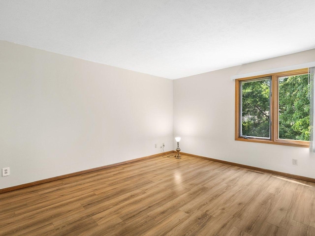 4176 Tumbleweed Trl Unit 0, Loves Park, IL 61111 - unfurnished room with wood finished floors and baseboards