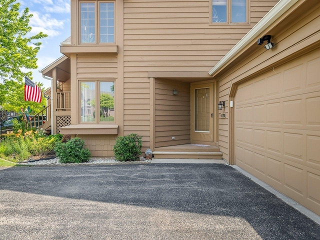 4176 Tumbleweed Trl Unit 0, Loves Park, IL 61111 - entrance to property with a garage