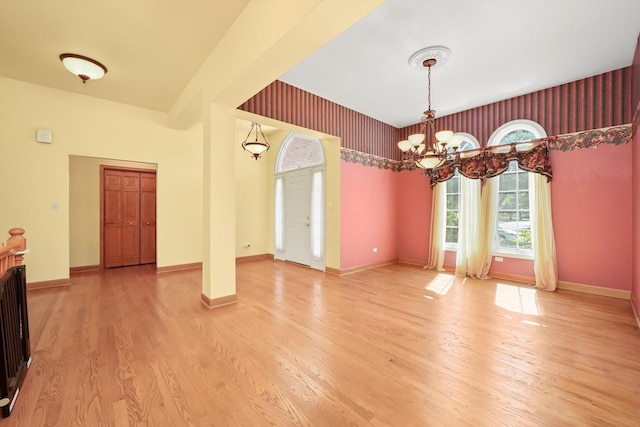 6443 Davane Ct, Downers Grove, IL 60516 - spare room featuring a chandelier and light wood finished floors