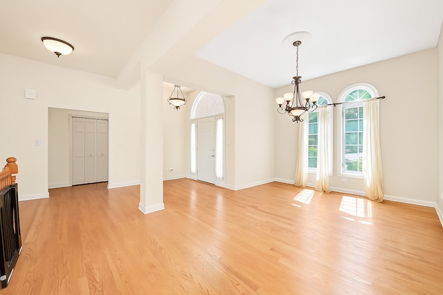 6443 Davane Ct, Downers Grove, IL 60516 - unfurnished living room featuring light wood finished floors and a chandelier
