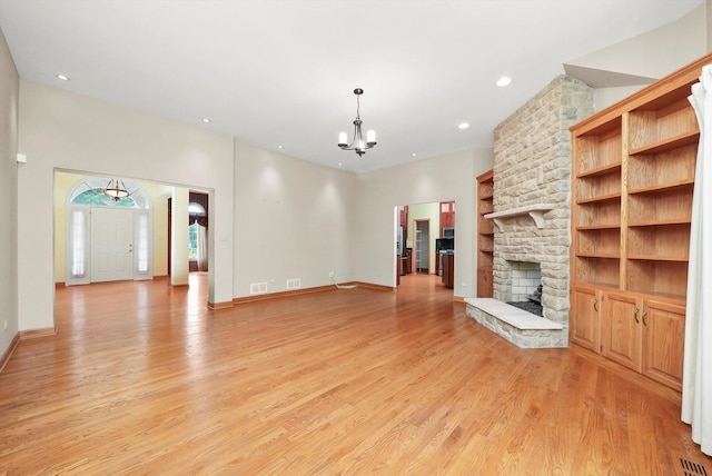 6443 Davane Ct, Downers Grove, IL 60516 - unfurnished living room with light wood-style floors, a chandelier, a fireplace, and recessed lighting